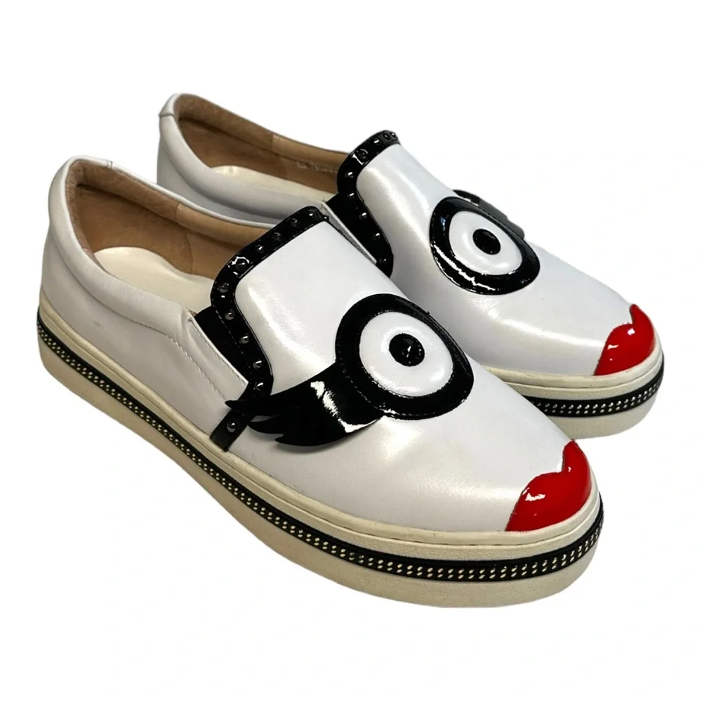 White Leather Slip-On Sneakers with Black Trim and Red Accent